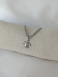 Bracelet argenté en acier inoxydable avec breloque tortue