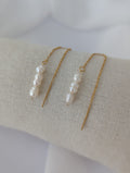 Boucles d'oreilles dorées longues en acier inoxydable avec des perles d'eau douce de 7 mm