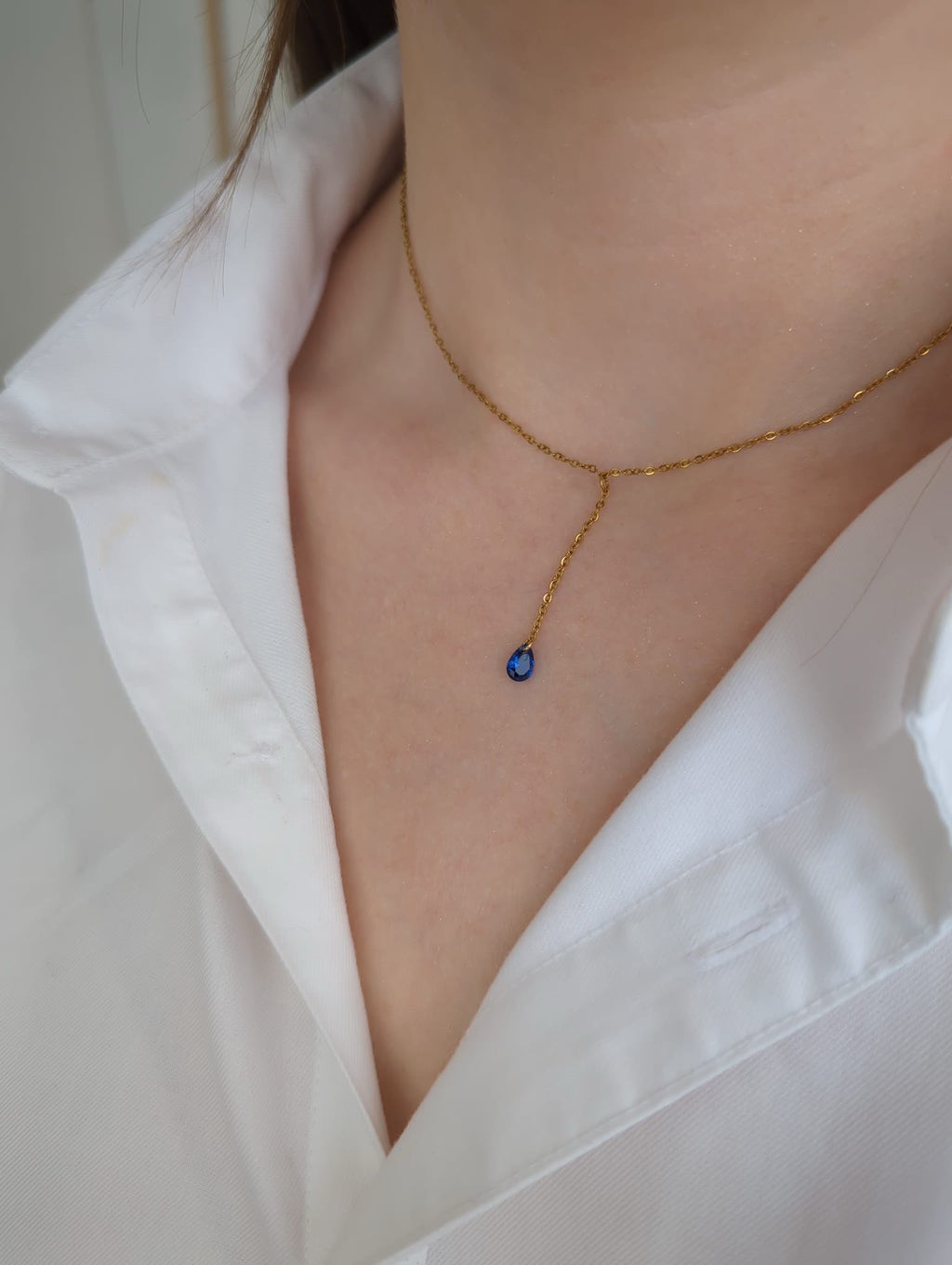 Collier doré en acier inoxydable avec pendentif zircon bleu