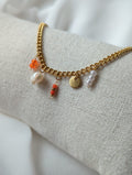 Bracelet doré en acier inoxydable avec breloques orange et perle d'eau douce